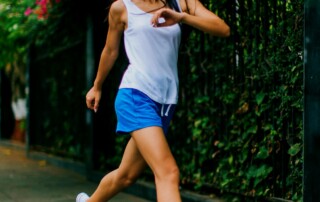 Healthy lady jogging in the street
